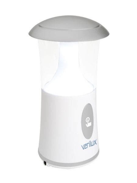 Verilux ReadyLight solar rechargeable LED lantern with handle extended, positioned outdoors on a wooden surface.
