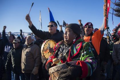 Protestors celebrate at Oceti Sakowin Camp earlier today. The Army Corps of Engineers notified the Standing Rock Sioux that the current route for the Dakota Access pipeline will be denied. Jim Watson/AFP/Getty Images